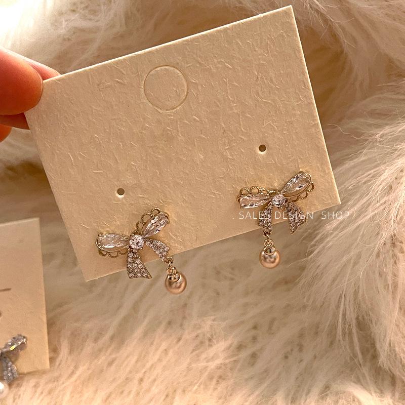 Korean Zircon Bow Pearl Stud Earrings - High-End, Versatile & Elegant.