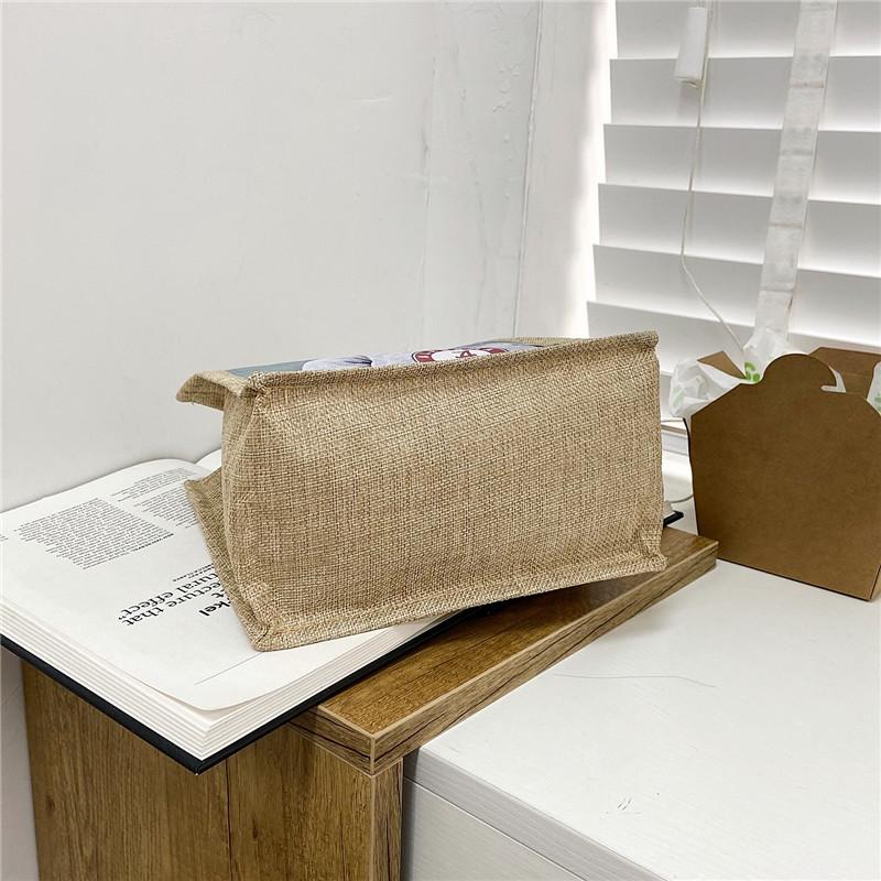 Cute hand-held lunch box lunch bag for women 2025 new Korean version ins student versatile Internet celebrity handheld canvas bag