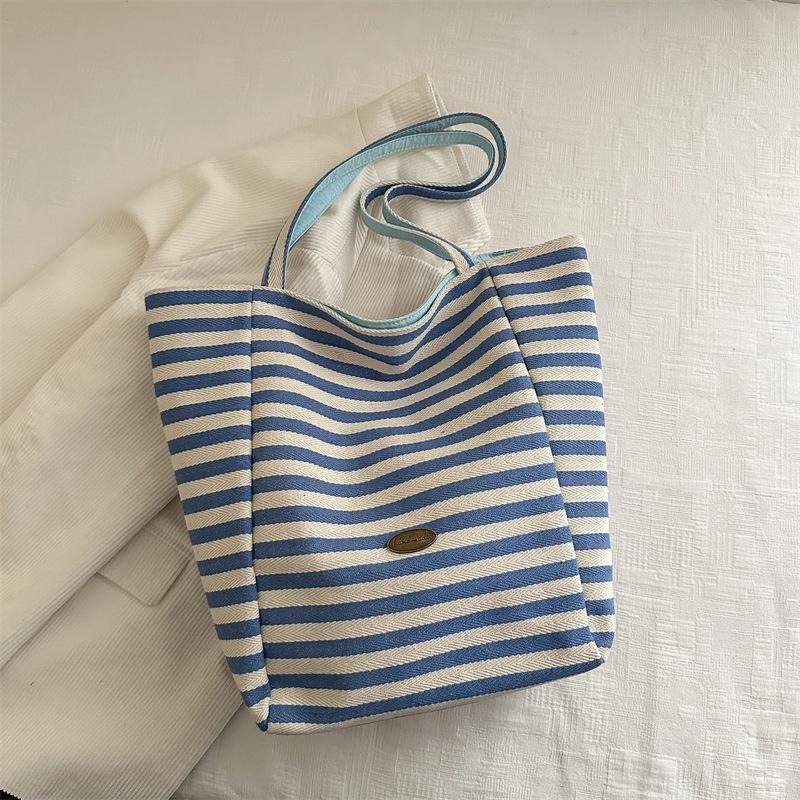 

Летняя полосатая холщовая сумка женская весна 2025 новая двухсторонняя сумка через плечо корейская портативная сумка для покупок синий
