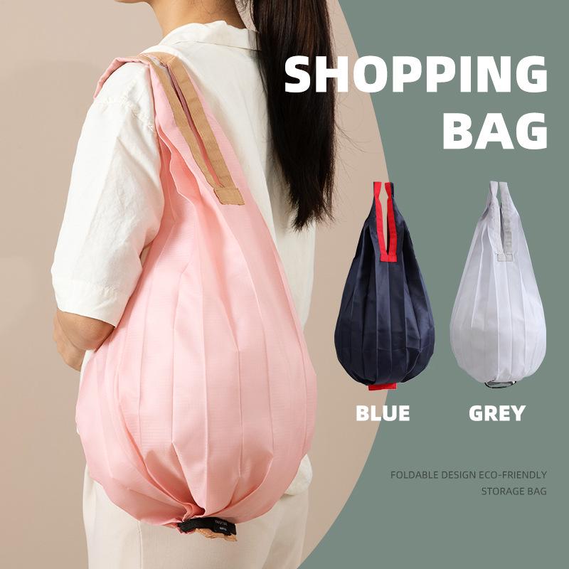 Eco-Friendly Foldable Shopping Bag: Large Capacity, Ultra-Light, Accordion Pleat Design with Hanging Buckle for Travel.