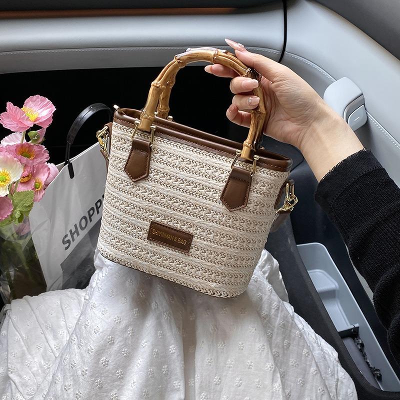 Gewebte Stroh-Eimer-Tasche Damen neue Mode Umhängetasche tragbare kleine Tasche