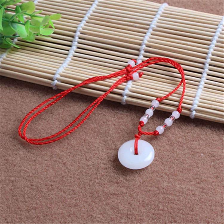 Hetian Jade Guanyin Buddha Pendant Necklace with Red String and Eight Bead Design.