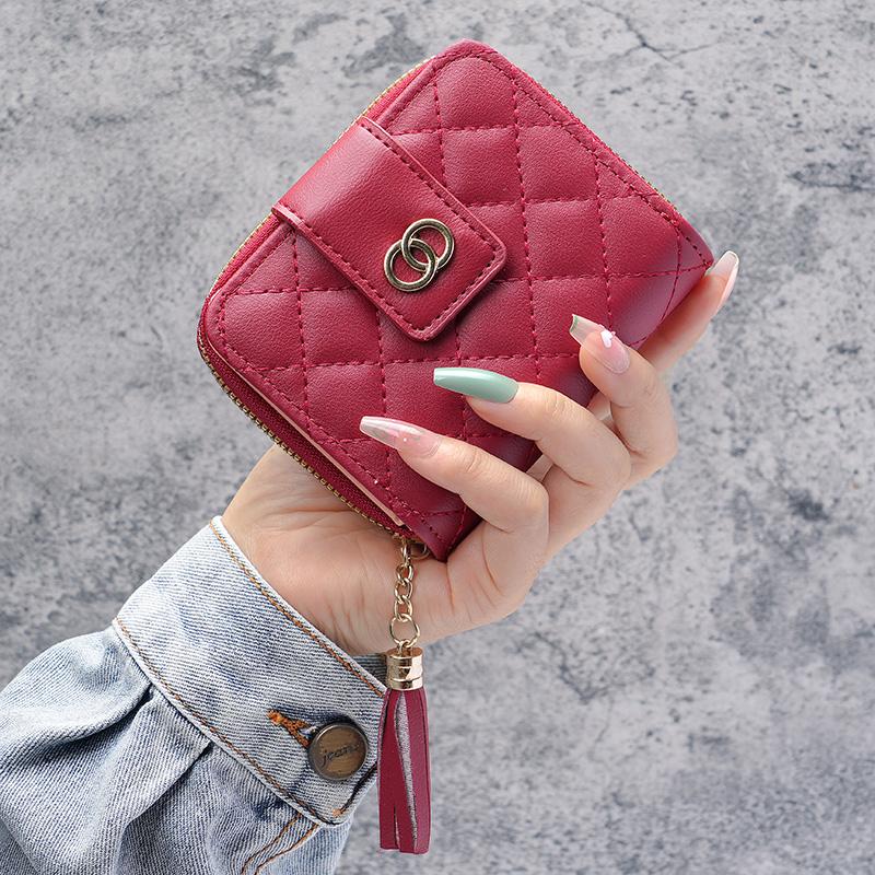 

Новый женский короткий кошелек на молнии, корейская версия вместительной сумки с кисточками, заводское поколение.