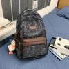 Schoolbag new graffiti niche schoolbag male junior high school student high school student lightweight backpack college student large capacity