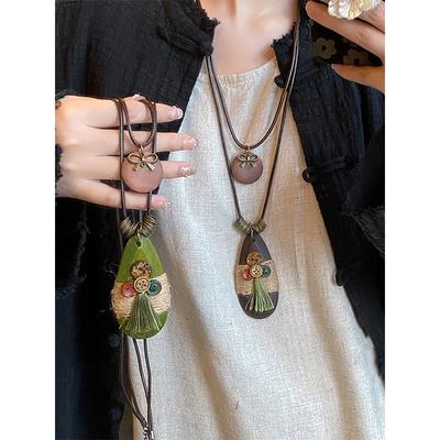 Collier double en forme de nœud ovale et copeaux de bois Style bohème Chaîne de pull Collier de mode de niche pour femmes