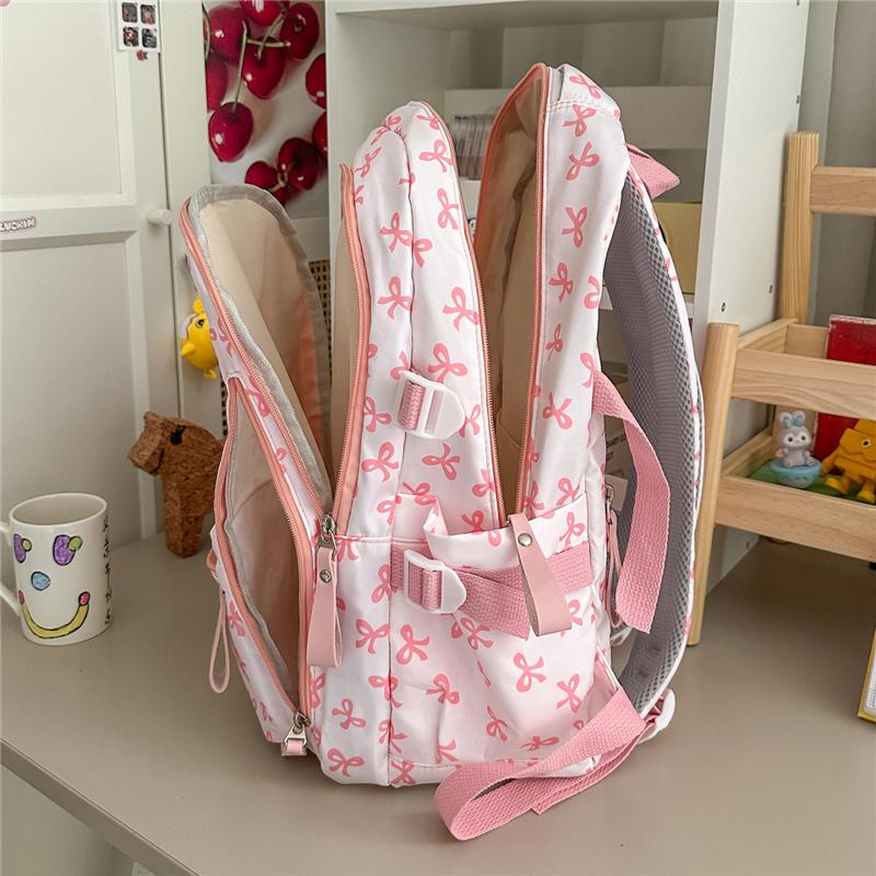 Cute Bow Print Backpack for Women Lightweight Casual Daypack Travel School Bag with Multi Pockets
