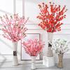 Manufacturers supply artificial peach blossom branches plum blossom branches fake peach blossom branches wedding decoration living room plastic flowe