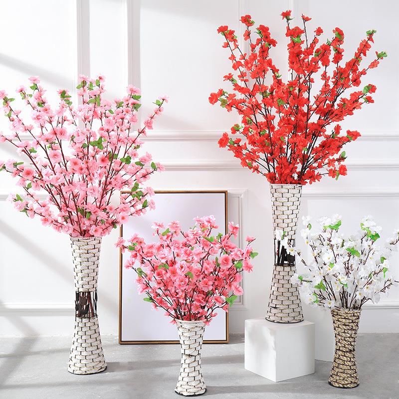 Manufacturers supply artificial peach blossom branches plum blossom branches fake peach blossom branches wedding decoration living room plastic flowe
