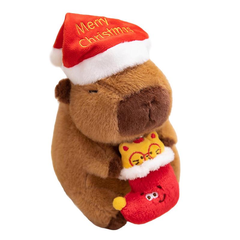 

1Pc 20/25CM Kawaii Christmas Capybara Plush Toys Cartoon Capibara Dolls Wears Xmas Hat Holding Gingerbread Man Nice Christmas Gift 20cm
