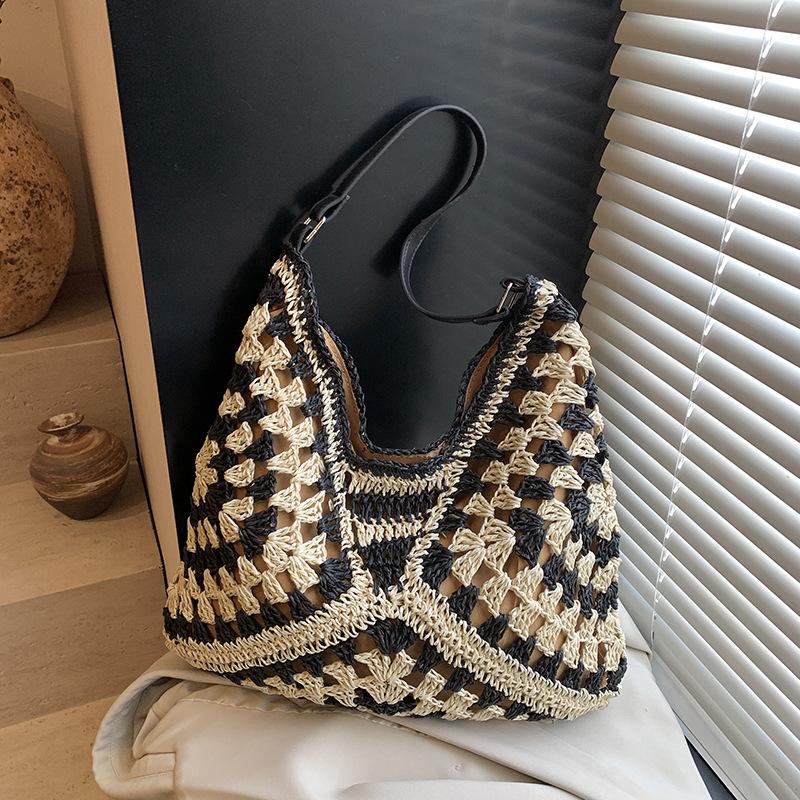 

Hollow woven straw bag women s large-capacity new summer shoulder commuting seaside vacation beach bag