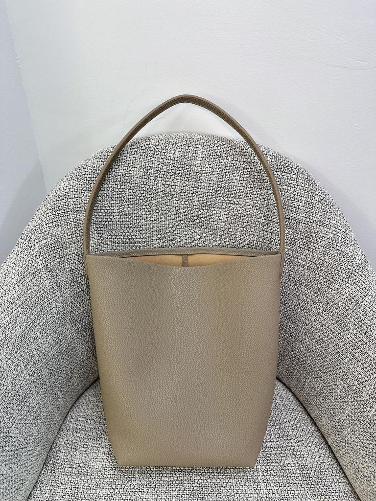 Nova bolsa de balde Row de grande capacidade em couro para mulher estilo minimalista TR com padrão de lichia bolsa tote portátil de ombro para o dia a dia