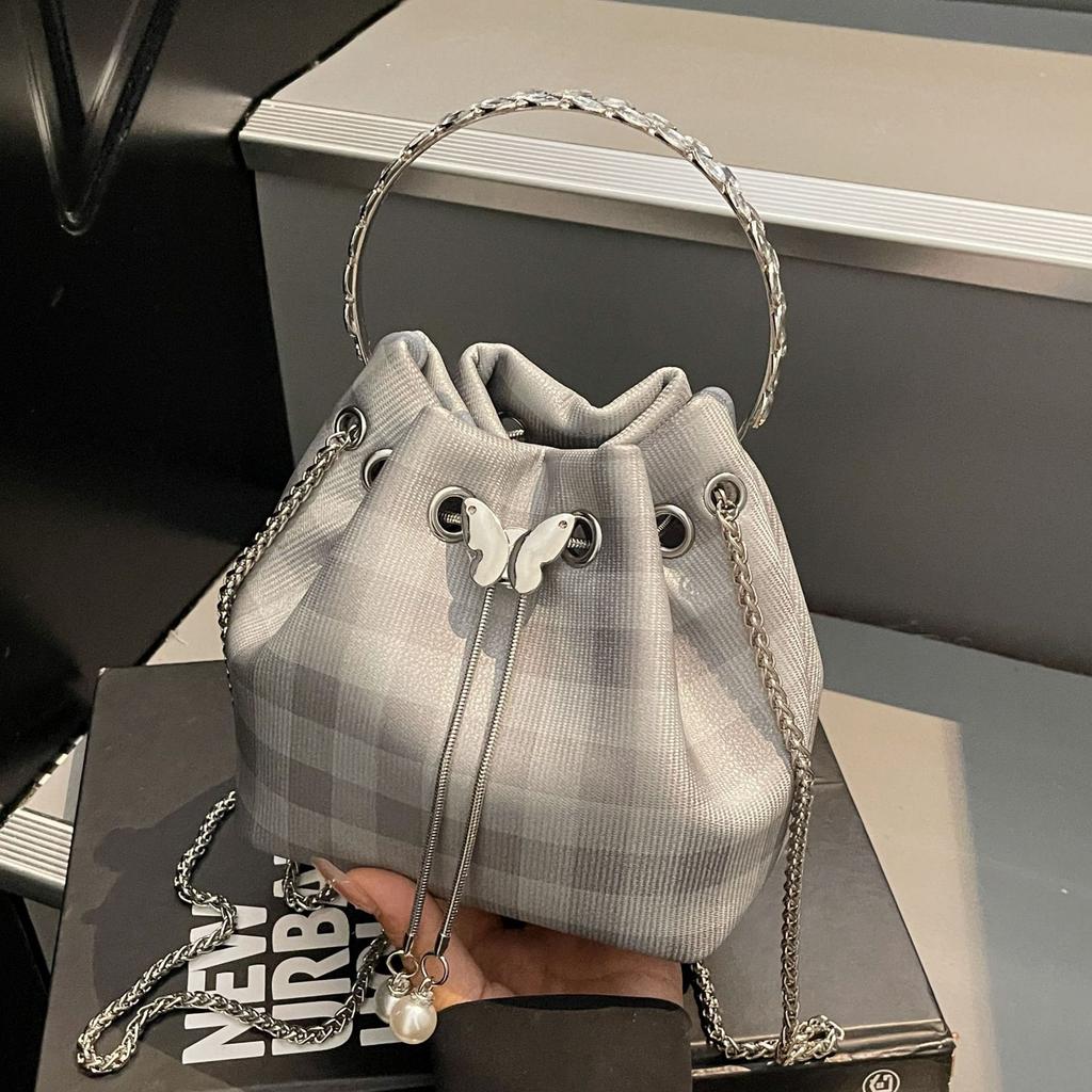 Korean niche design simple and fashionable portable small bag women's 2025 summer new crossbody plaid bucket bag tide