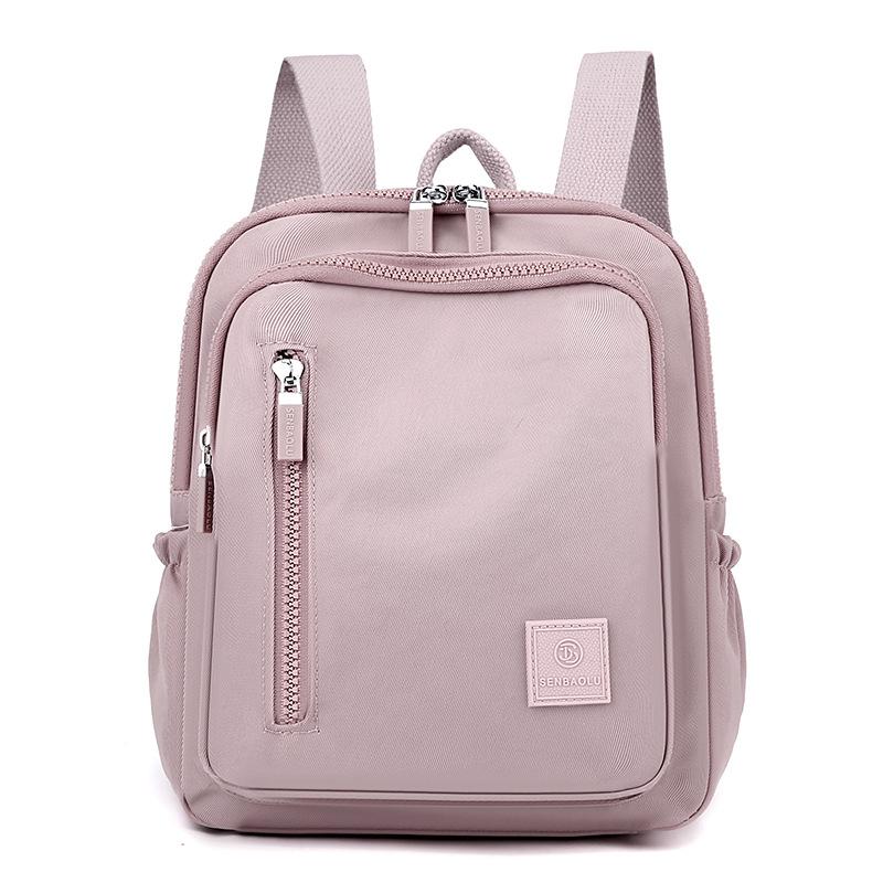 

Жіночий плечовий свіжий, солодкий, стильний і простий нейлоновий однотонний дорожній рюкзак світло-фіолетового кольору