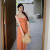 The Real Shot of the New Floral Vacation Dress Closes the Waist and Shows White and Orange Suspender Skirt.