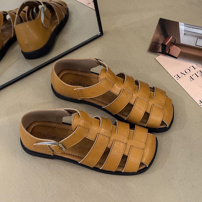 

2025 summer new bag head hollow soft sole Roman shoe buckle flat bottom woven retro large size beach sandals women 40