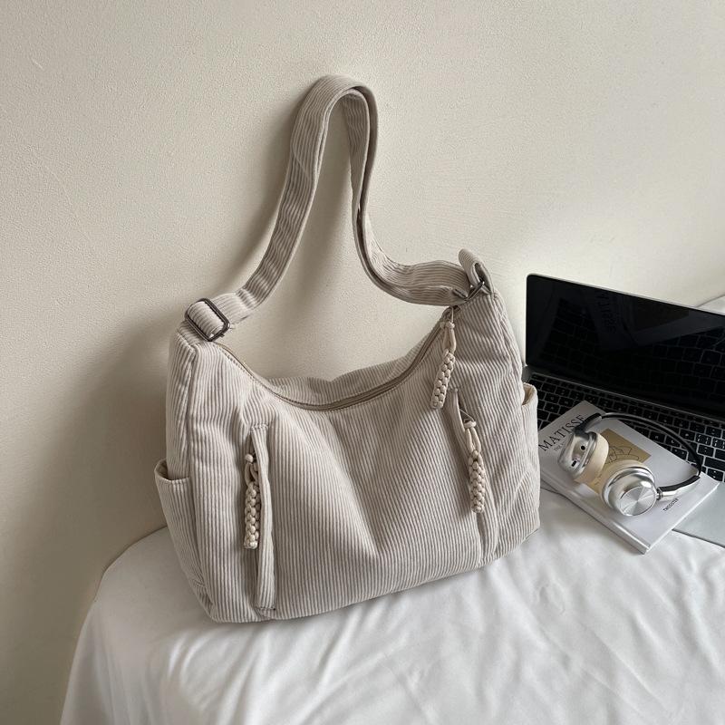 

2025 autumn new commuter large capacity solid color fashion dumpling bag waterproof simple shoulder bag messenger bag women покинуть белый