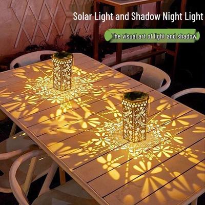 Outdoor Solar Wrought Iron Lantern: Waterproof Hollow Projection Table Lamp for Courtyard and Garden