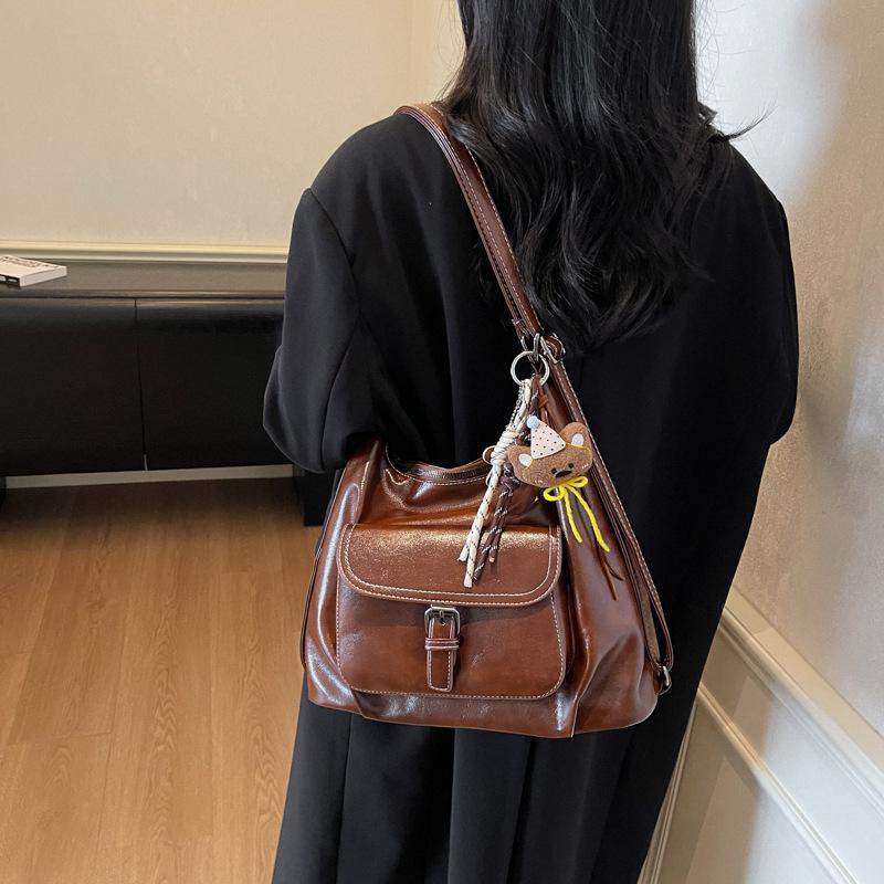 Casual large capacity retro bag women 2025 new versatile shoulder bag double shoulder backpack commuter bucket bag