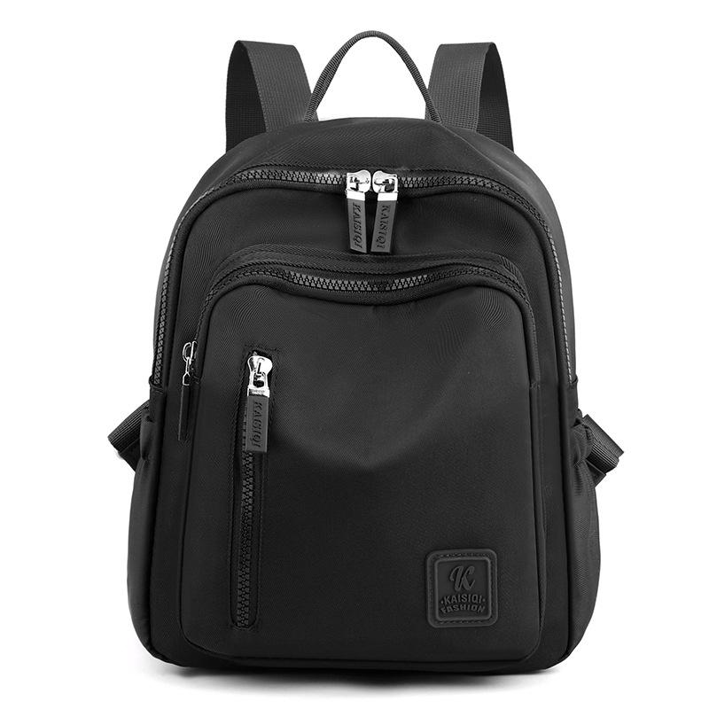 

2025 Новый нейлоновый брызгозащищенный рюкзак большой вместимости женский для активного отдыха и путешествий водонепроницаемый нейлоновый портативный школьный рюкзак мужская дорожная сумка чёрный