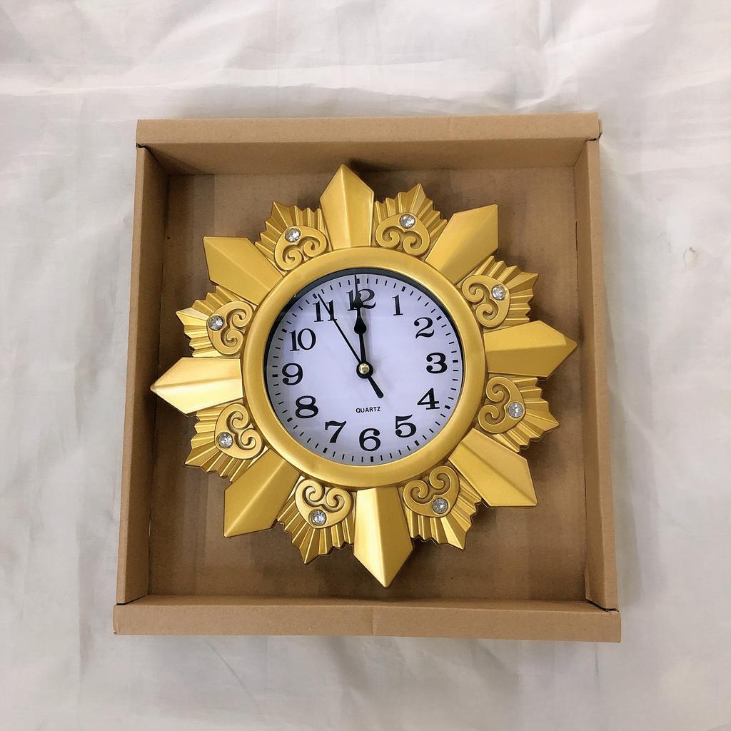 Retro hollow quartz clock, living room fashion craftsmanship 25cm wall clock