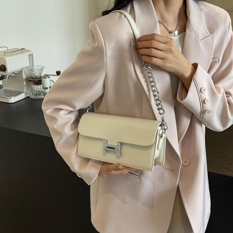 Novo estilo para primavera e verão Bolsa versátil de axila para mulheres Bolsa de ombro texturizada