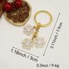 European & American Christmas Snowflake Keychain with Bell Pendant - Creative Alloy Ornament Gift