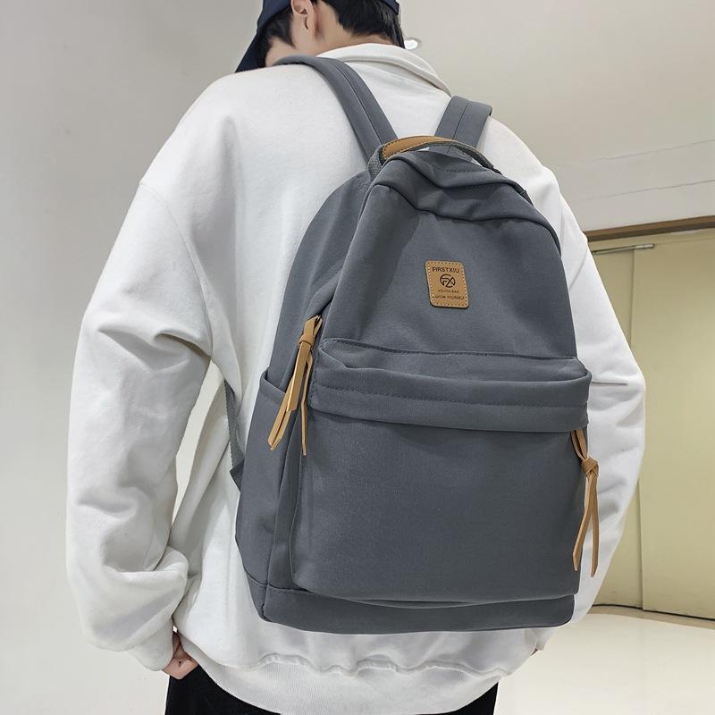 Japanese solid color backpack female Korean version Harajuku simple high school student backpack campus junior high school student couple schoolbag
