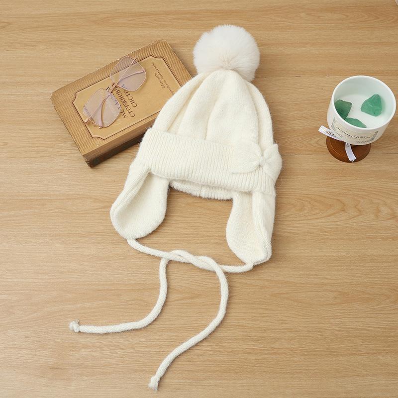 Hat women's autumn and winter cute hairball knitted wool hat thickened ear protection warm fashionable versatile