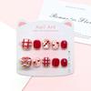 Red Detachable Reusable Kids' Manicure: New Year Lion & Cat Eye Style Nail Stickers for Brightening Skin.