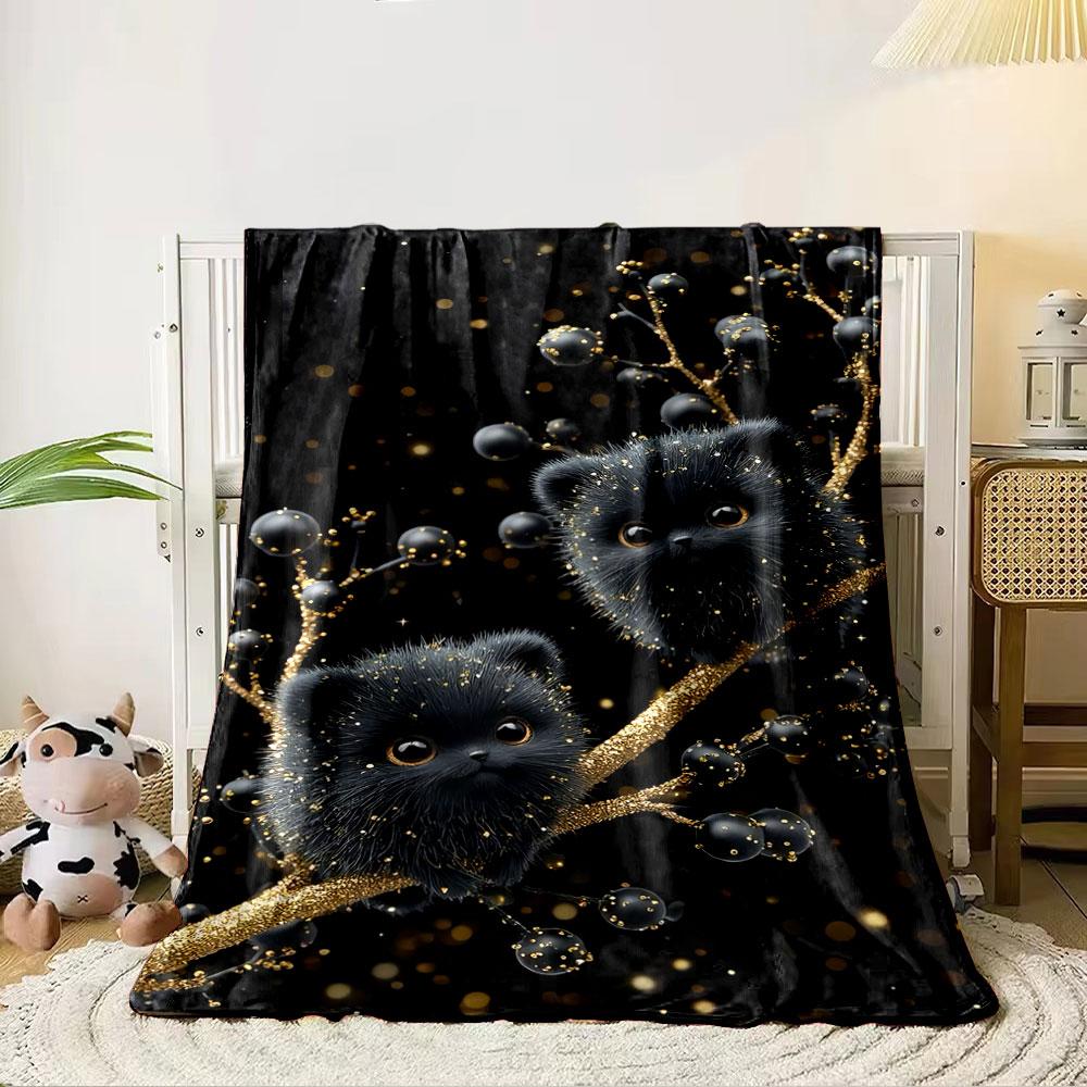 Fluffy black creatures sit on glittering gold branches with dark berries. for all seasons blanket lunch break throw gift 80cm x 120cm