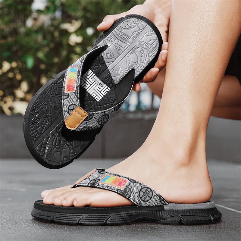 Fashion Men's colorful - pattern flip - flops. Upper with label, two - toned soles. Stylish, casual design. Comfortable & versatile.