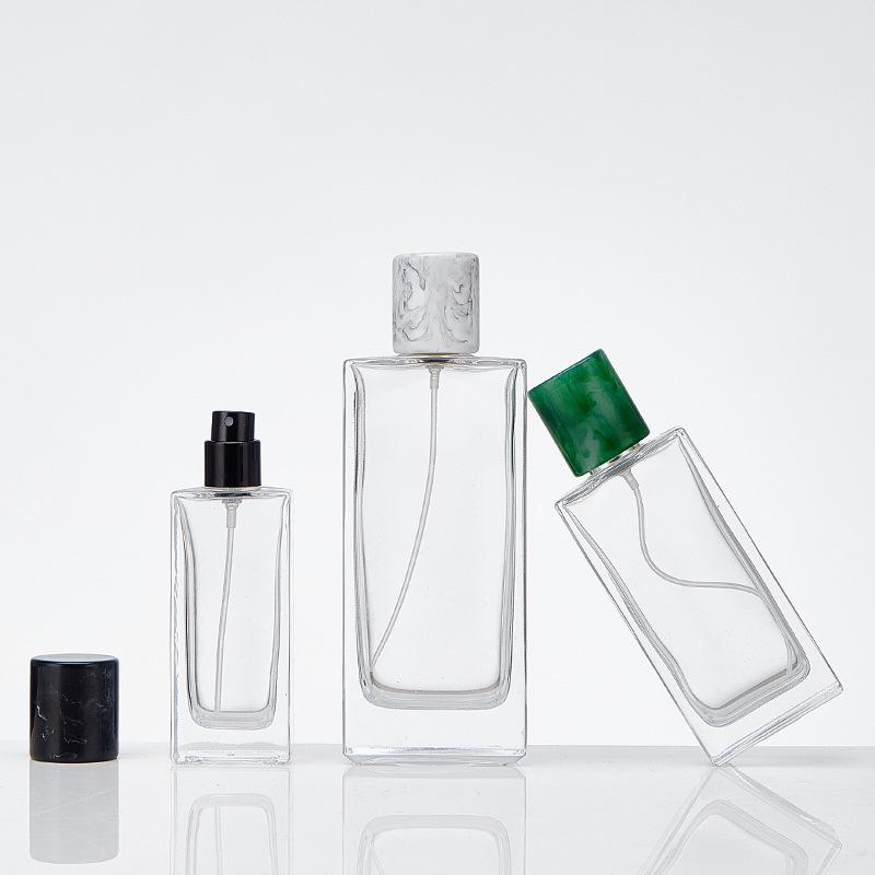 In-Stock Transparent Bayonet Glass Perfume Bottle with Resin Lid and Spray Refill