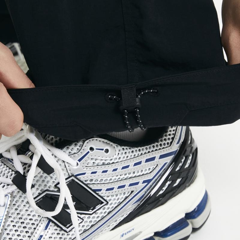 New Balance Nbnte11013 Uni Ess Heritage Woven Straight Pants Black