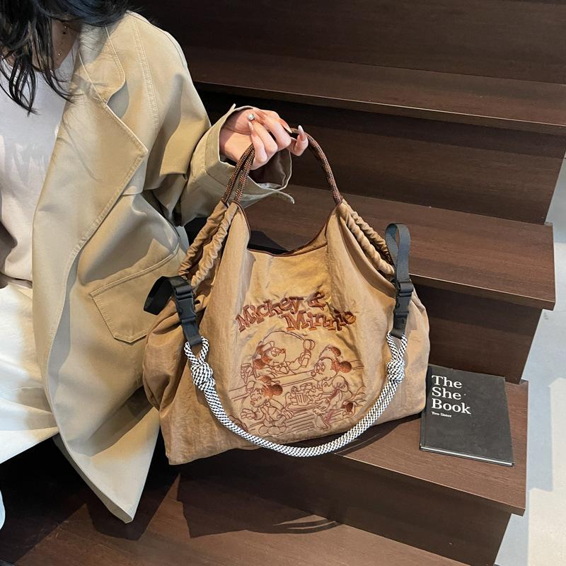 

2025 casual art canvas bag fashion cartoon embroidery handbag large capacity Mickey shoulder bag women s bag