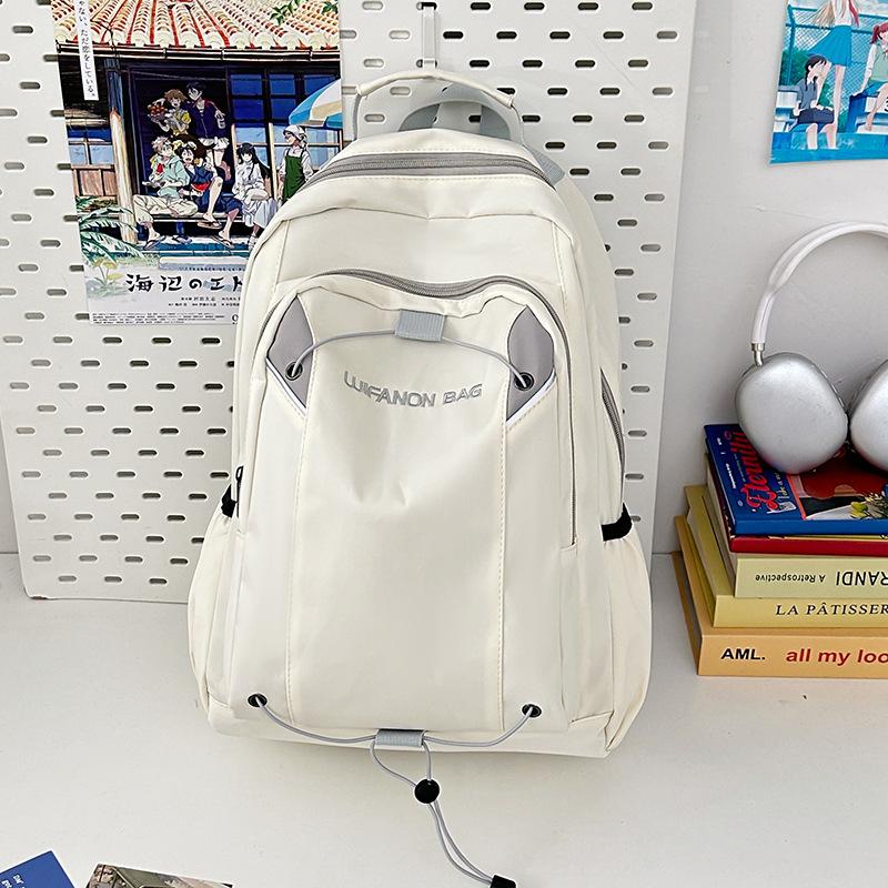Simple and fashionable student backpack New casual outdoor sports backpack Middle school student large-capacity college style schoolbag