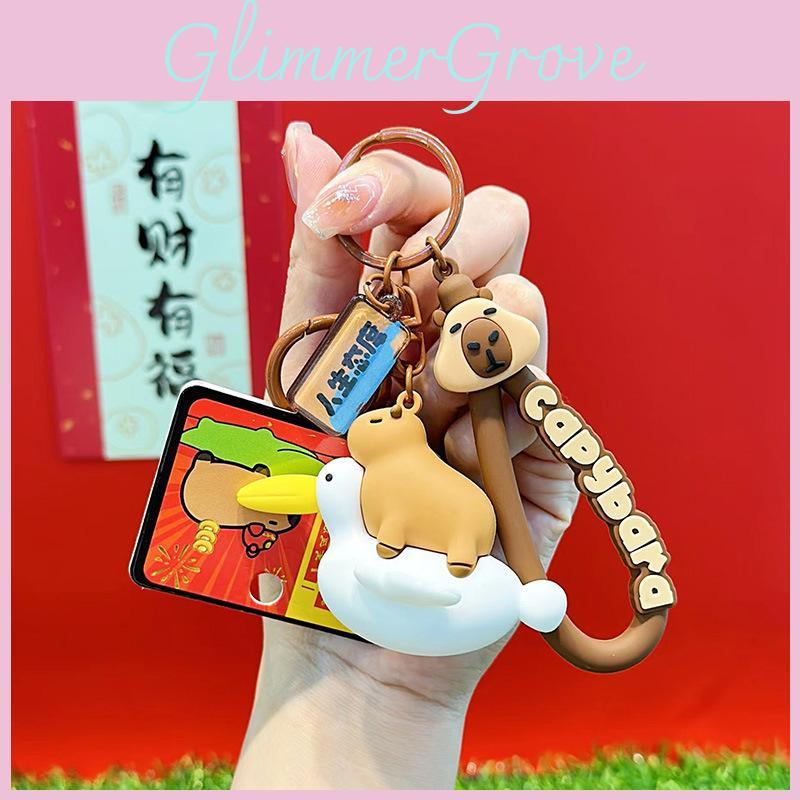 Charmantes Capybara- und Cartoon-Freunde-Schlüsselanhänger mit bunten Krokodil- und Schildkrötenköpfen
