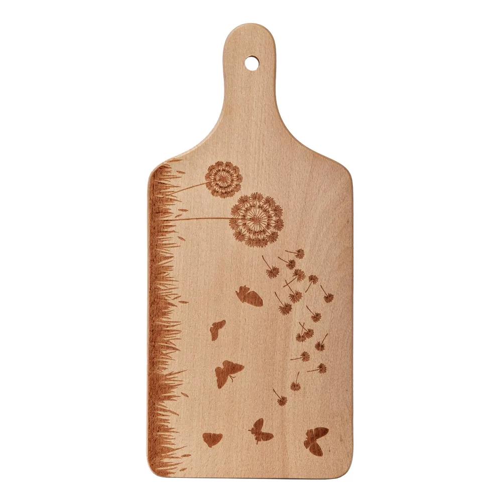 Wooden cutting board with an engraved meadow