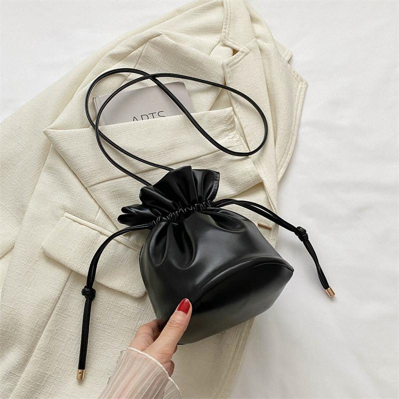 Fashionable Simple Bucket Bag For Women With Soft Structure Available In Black White Brown And Fuchsia