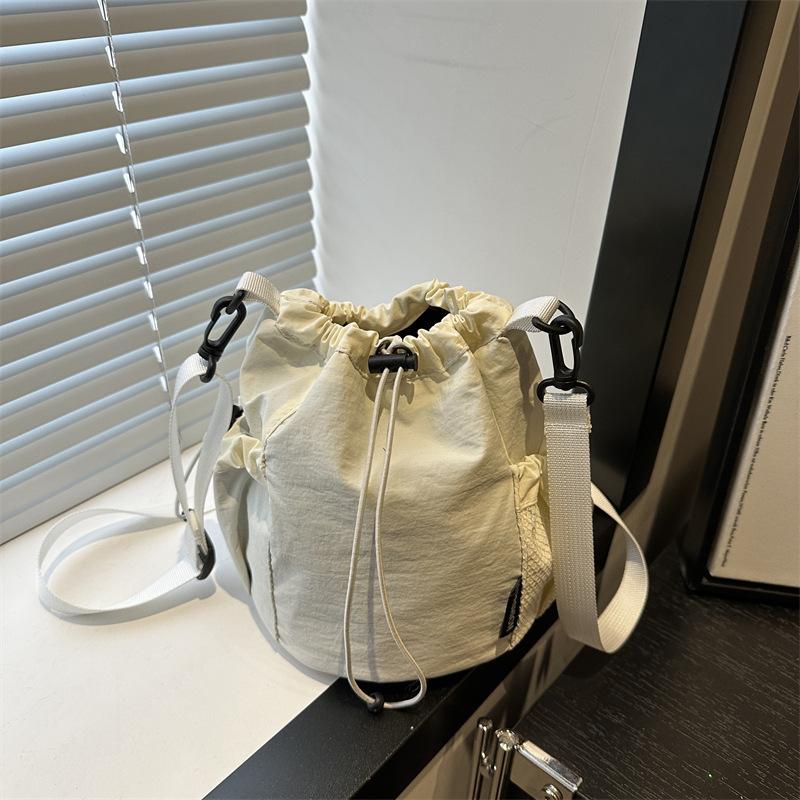 2025 Summer New Japanese and Korean Niche Drawstring Bundle Canvas Shoulder Messenger Bag Women's Light Lazy Wind Bucket Bag