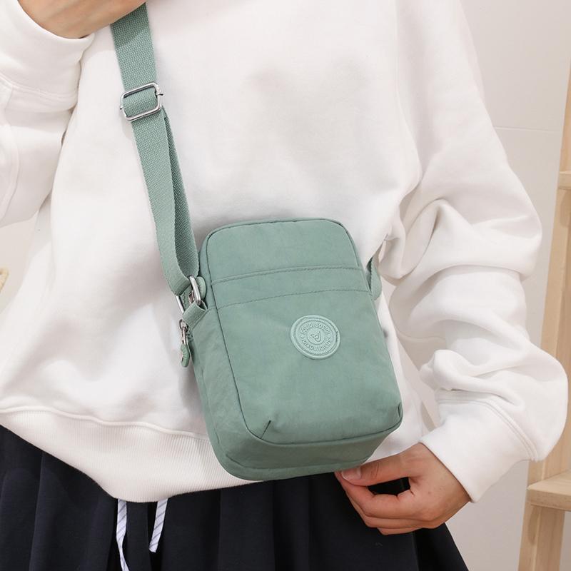 Compact Nylon Crossbody Bag with Double Zipper Closure Adjustable Strap Small Casual Purse for Daily Travel