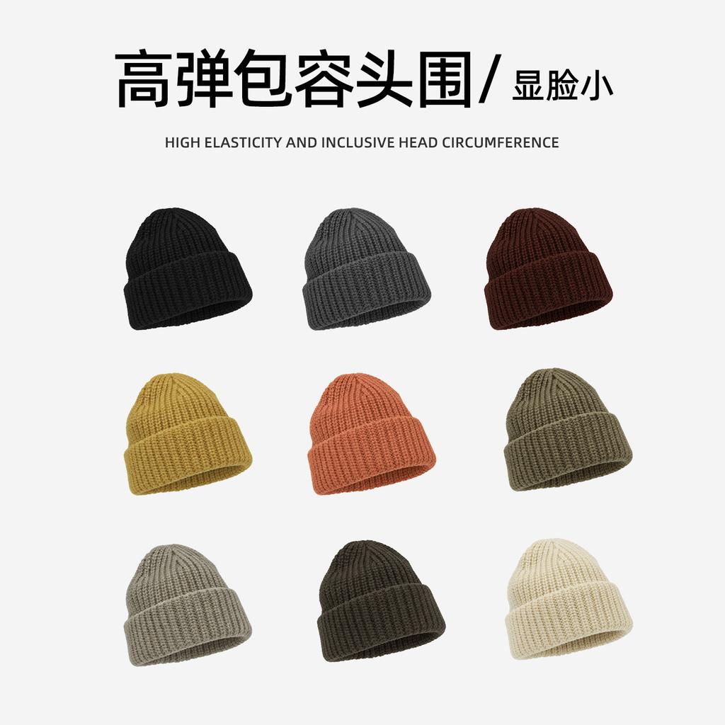 Autumn and winter widened flanged version solid color vertical pattern knitted cold hat simple soft waxy flanged head wool hat women