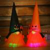 Luminous Ghost Face Halloween Doll Figurine with Rudolph Pendant for Window Display.