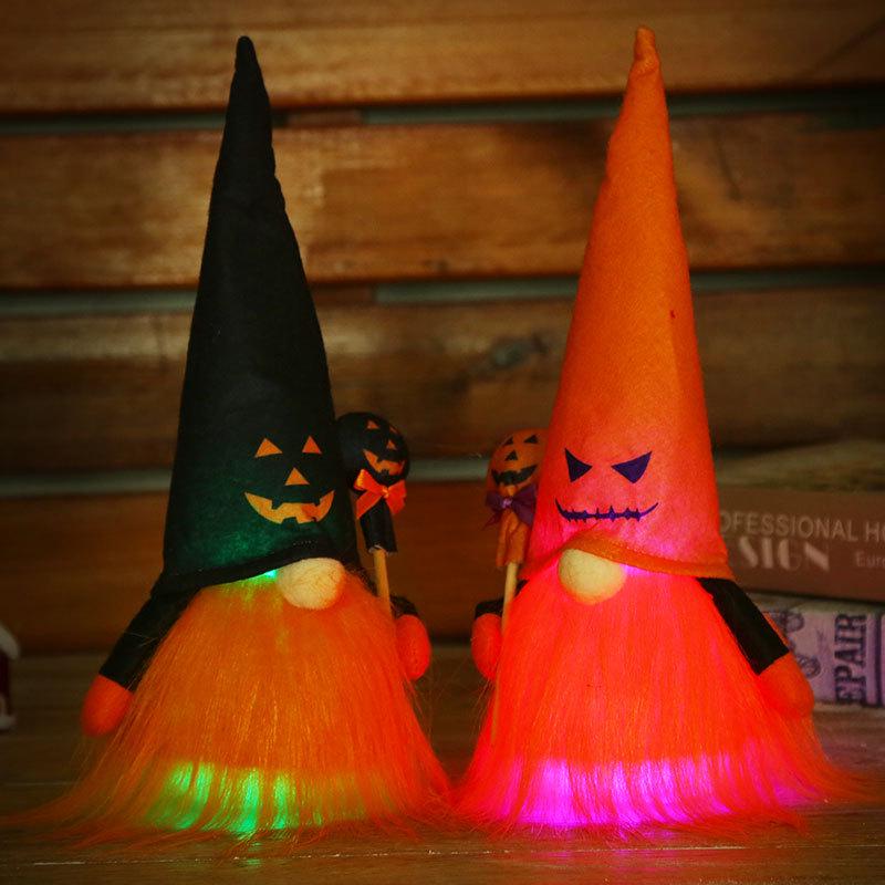 Luminous Ghost Face Halloween Doll Figurine with Rudolph Pendant for Window Display.