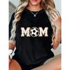 Proud Soccer Mom Game Day T-Shirt - Casual Black Crew Neck Short Sleeve Top, Featuring Shimmering Golden MOM Lettering with Soccer Ball Graphic