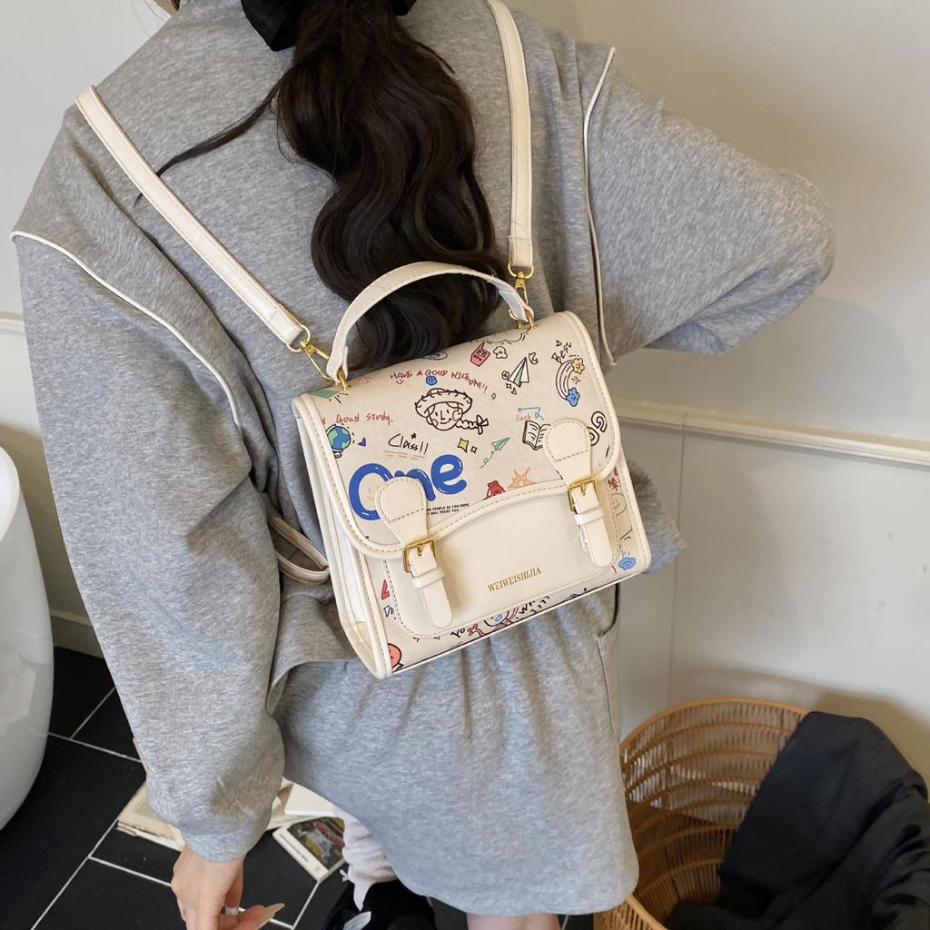 Korean version of college style cute cartoon printed handbag women 2025 new fashion casual backpack student schoolbag