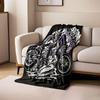 A goat-headed figure with wings and a seated woman beside a motorcycle. for all seasons blanket lunch break throw gift