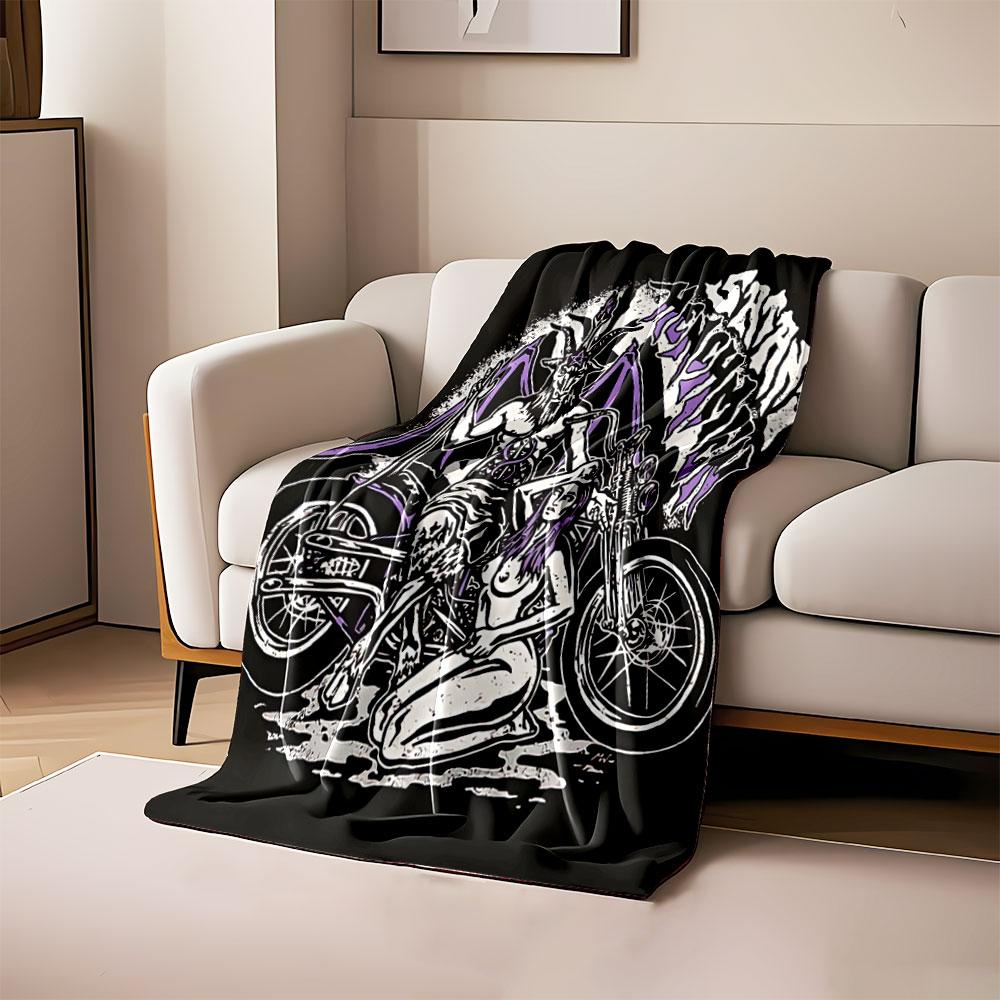 A goat-headed figure with wings and a seated woman beside a motorcycle. for all seasons blanket lunch break throw gift