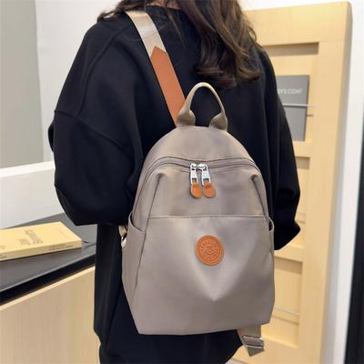 Sac à dos femme nouveau polyvalent pour les trajets quotidiens grande capacité tissu nylon léger petit sac tendance simple