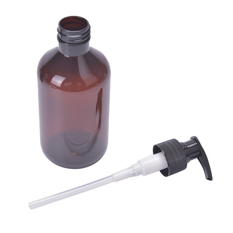 Bernsteinfarbene Plastik Leere Quetschflasche mit Schwarzem Lotionspender Probenbehälter