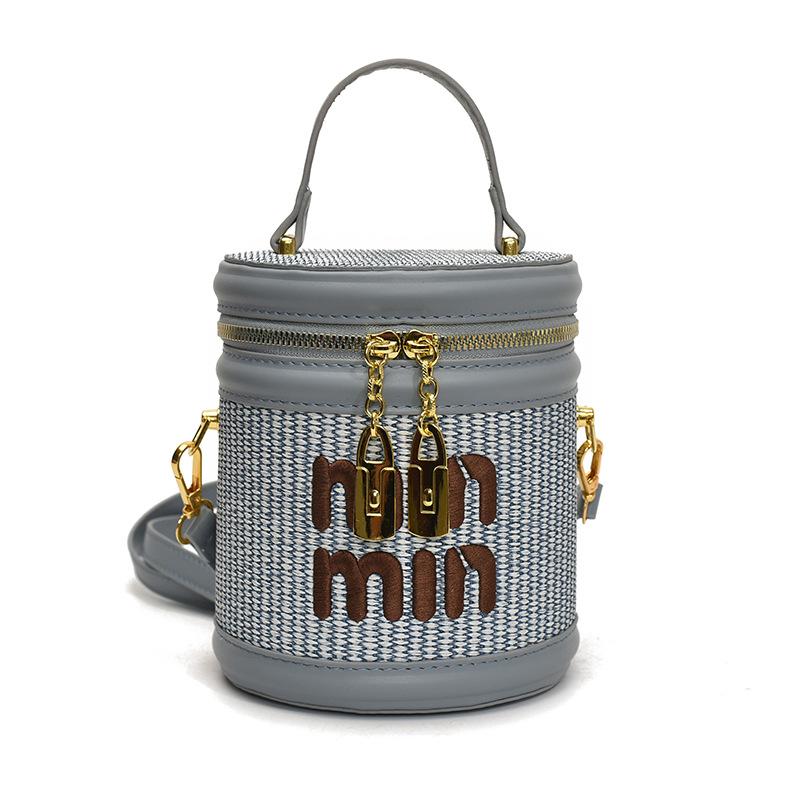 

Korean version of small bag women s fashion trend niche messenger bag texture contrasting color letter portable bucket bag синий